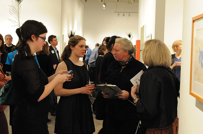 faculty discussing at art auction